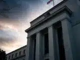 Bitcoin Drops to $76,877 as Fed Rate Hike Odds Jump to 55.7%